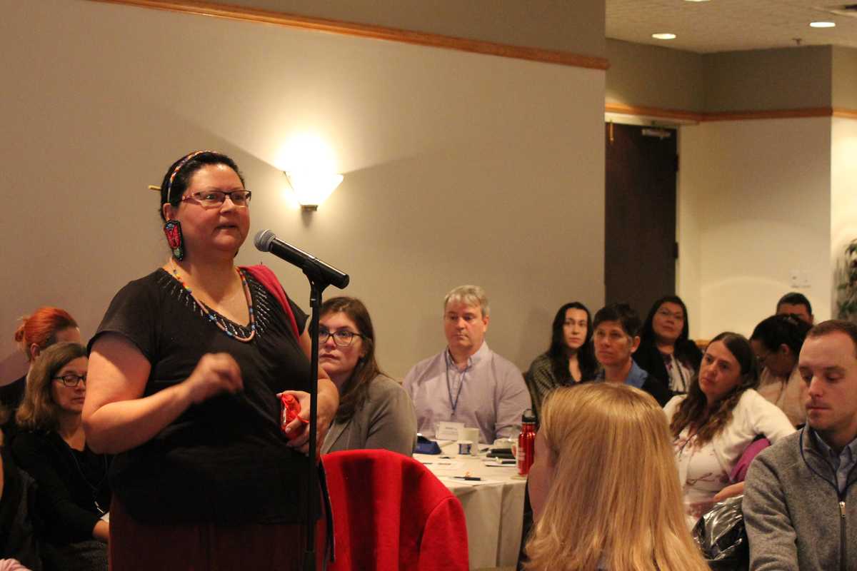 Presenter speaking to crowd at the National Discussion