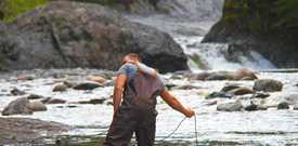 Man water sampling in river